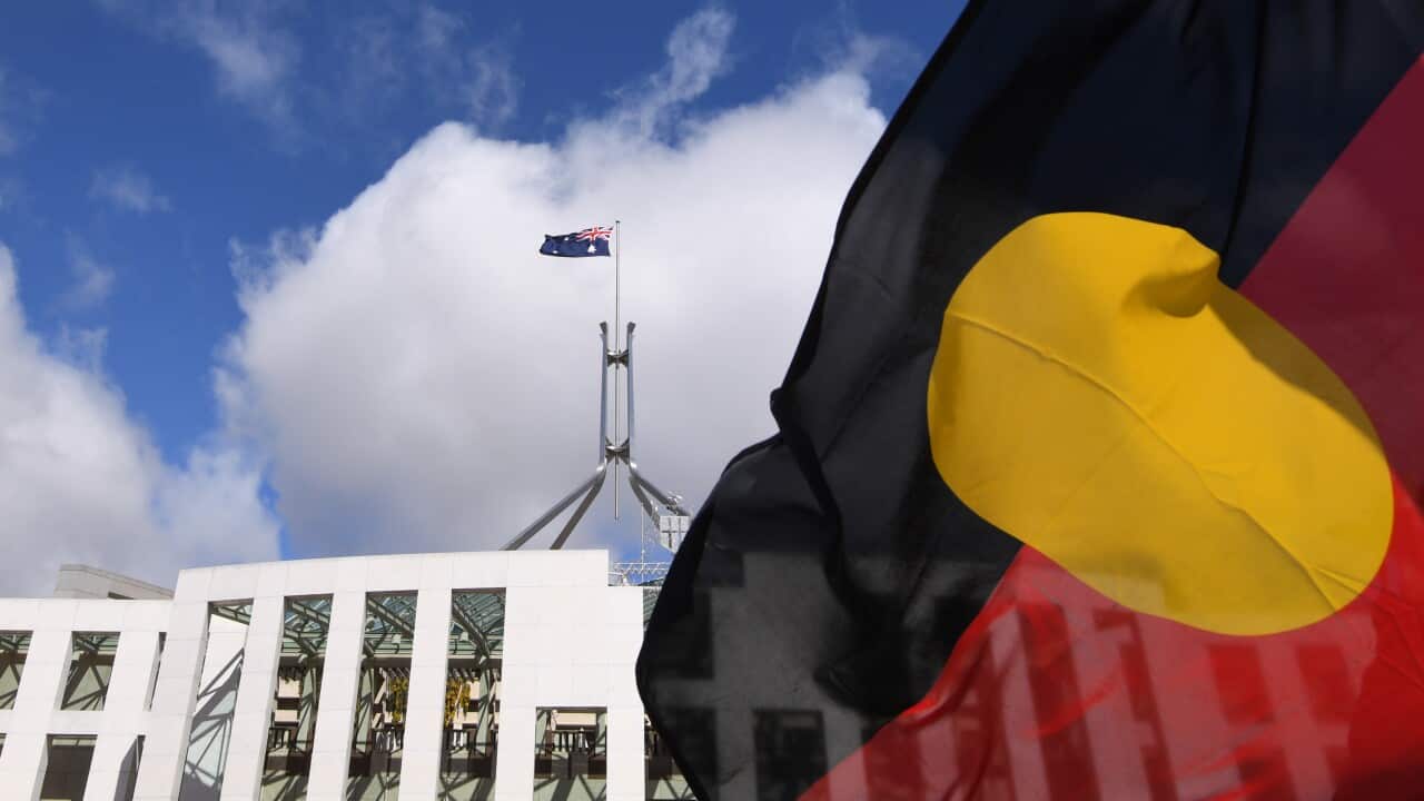 The Aboriginal flag flies outside Parliament House