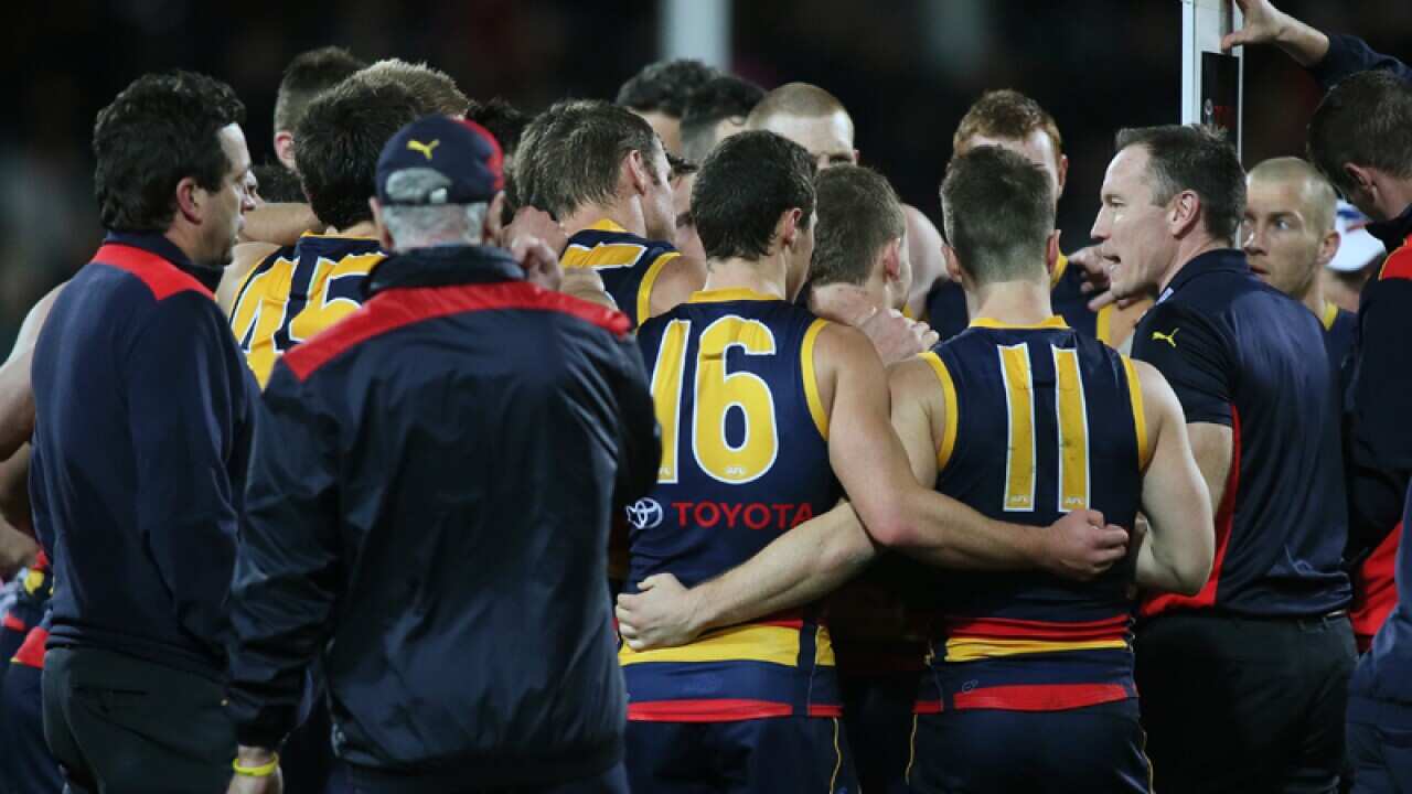 Adelaide Crows coach Brenton Sanderson talks with his team