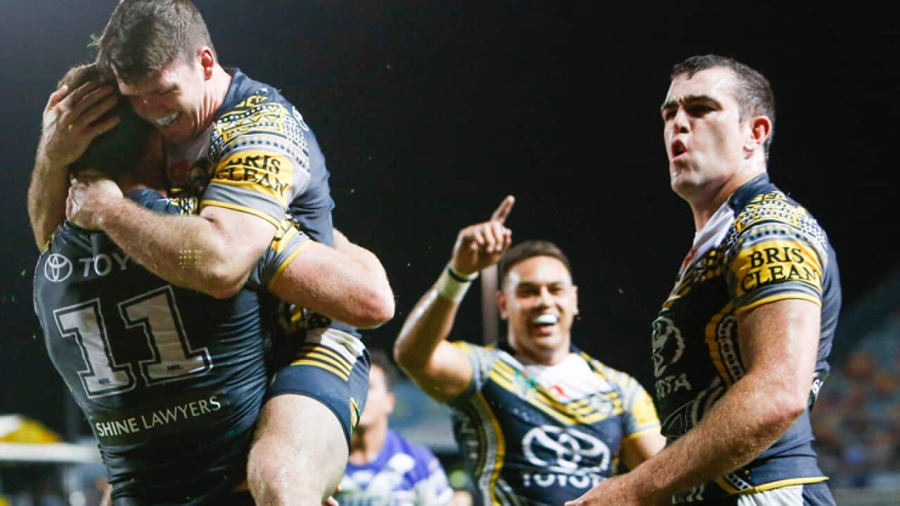 Cowboys Lachlan Coote congratulates Gavin Cooper.