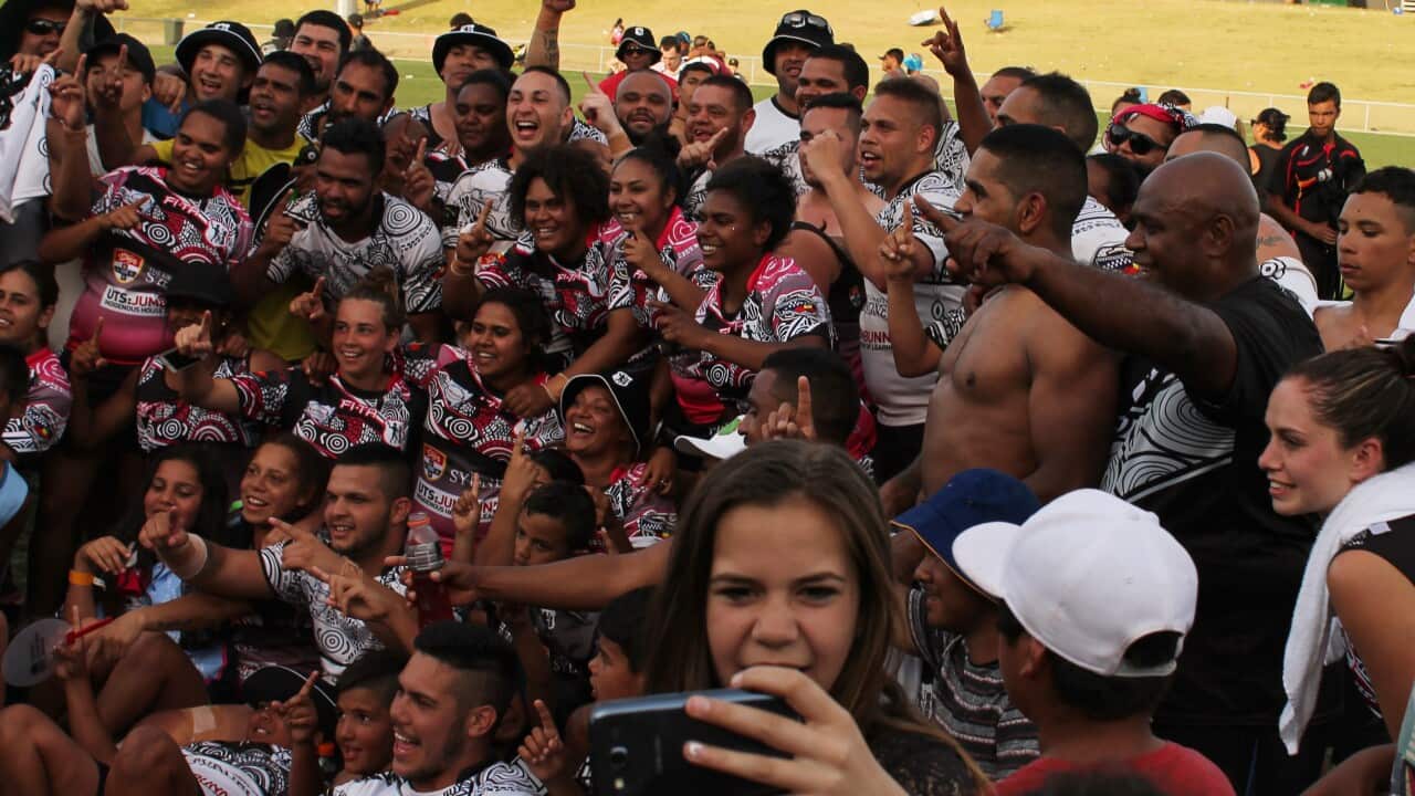 The 2015 Koori Knockout champions of the Men's and Women's tournaments celebrate.