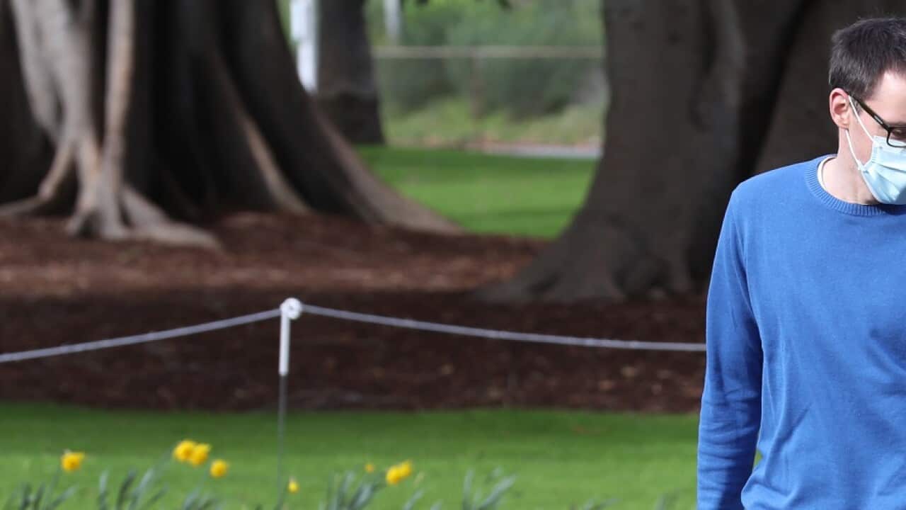 People are seen at Fitzroy Gardens in East Melbourne, Saturday, July 18, 2020. Victoria has recorded 217 new COVID-19 cases today bringing the state's number of active cases to 2608. (AAP Image/David Crosling) NO ARCHIVING