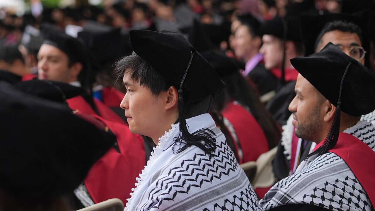 Harvard University students wearing a keffiyeh during a graduation ceremony on May 29, 2025.