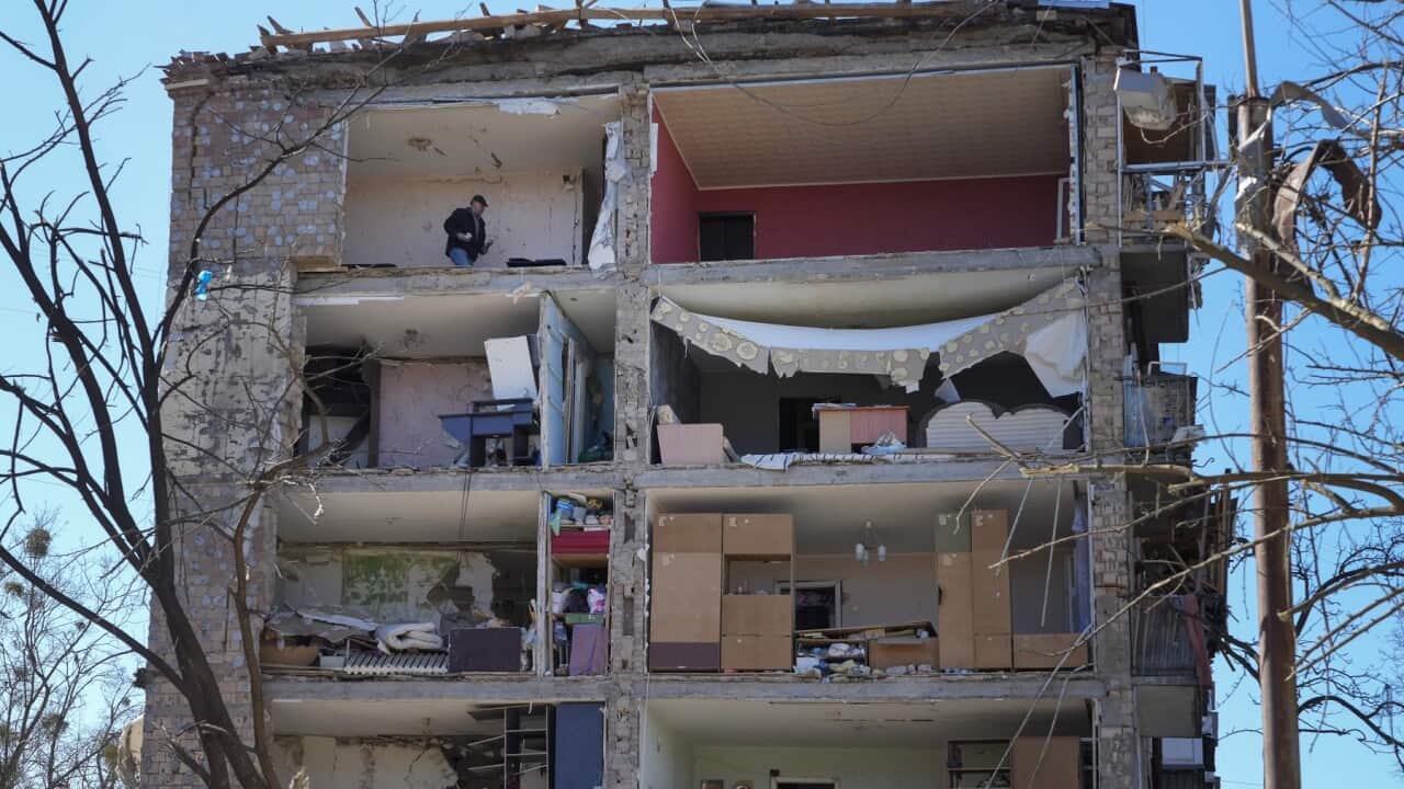 A man walks in his apartment ruined after the Russian shelling in Kyiv.