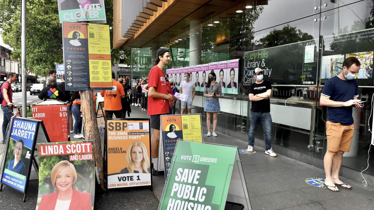 Members of the public line up to vote during NSW local council elections day at Surry Hills Library in Sydney, Saturday, December 4, 2021. (AAP Image/Bianca De Marchi) NO ARCHIVING