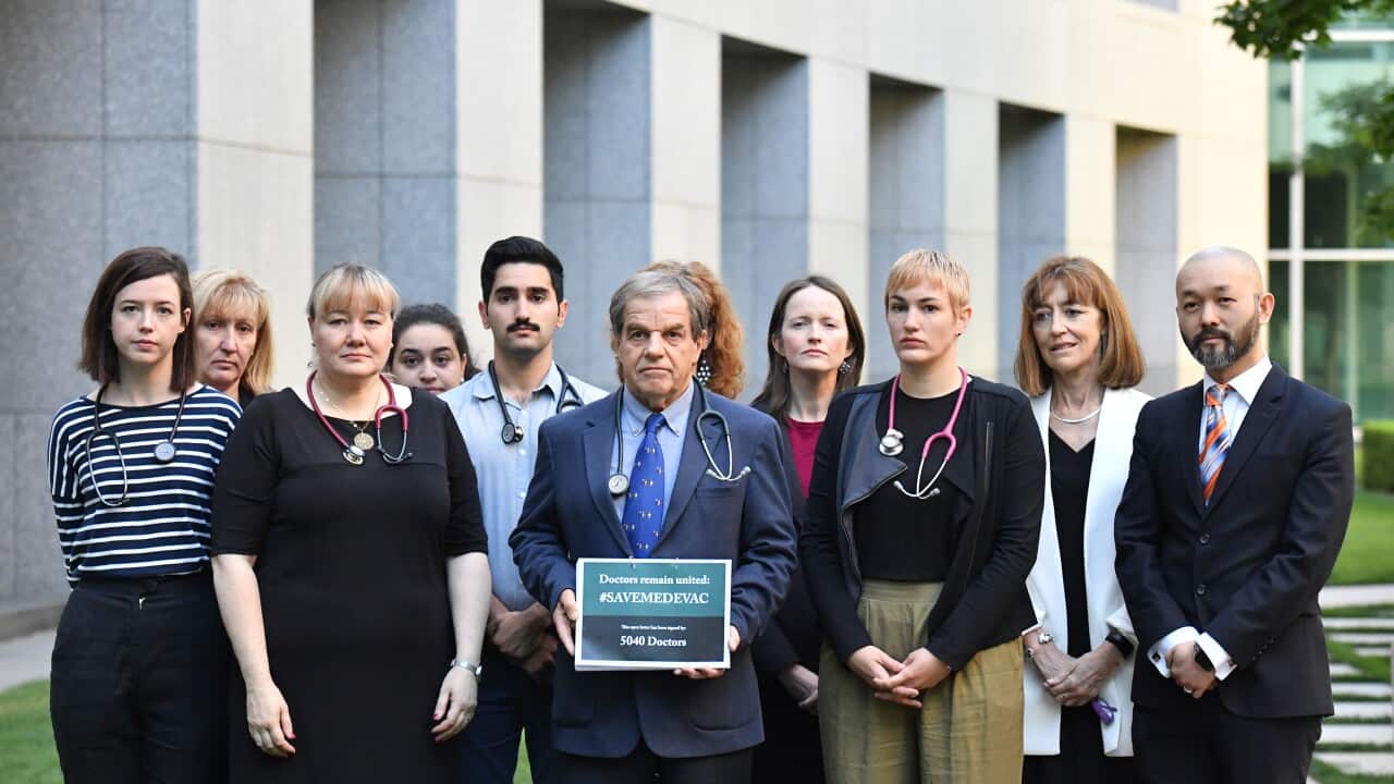 Paediatrician Professor David Isaacs and 13 colleagues at a press conference at Parliament House in Canberra.