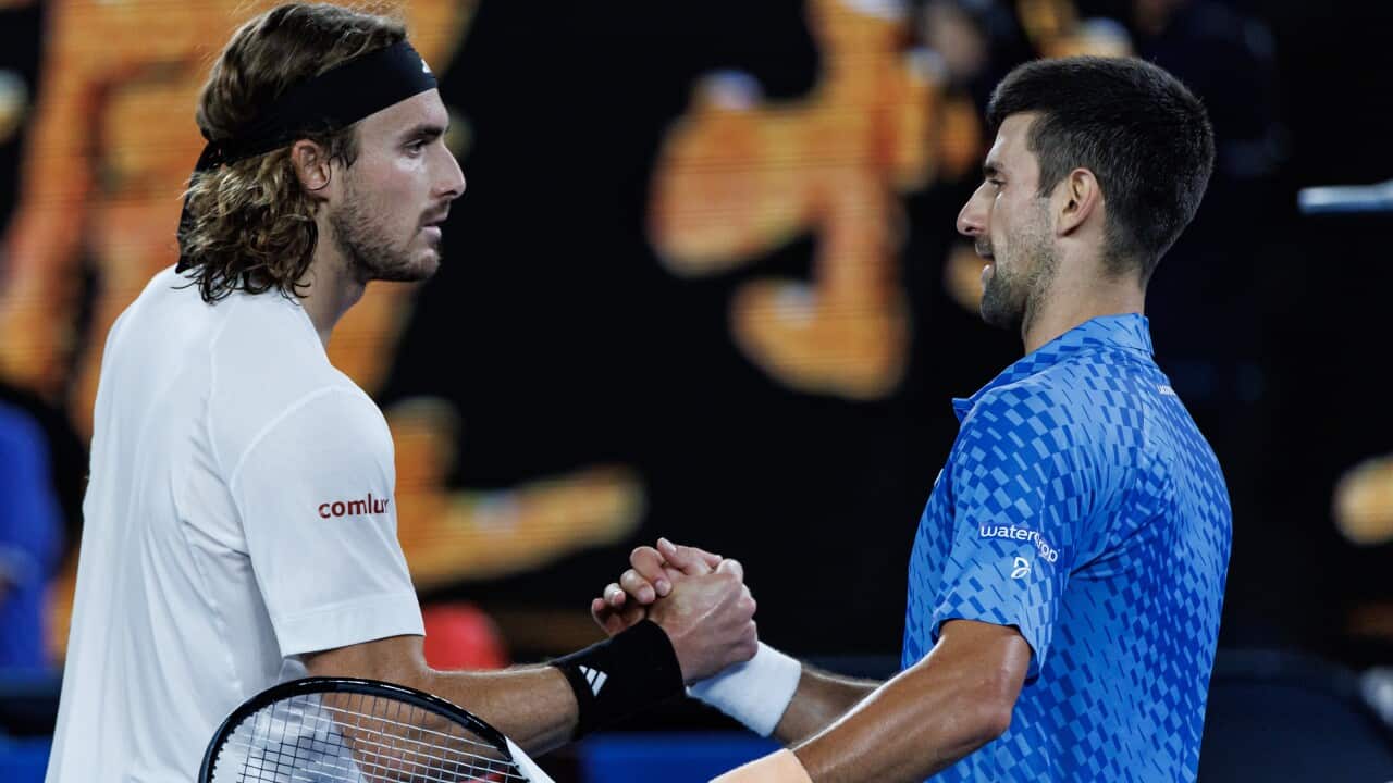 Novak Djokovic of Serbia shakes hands with Stefanos Tsitsipas of Greece after beating him in the men's final on day fourteen of the 2023 Australian Open