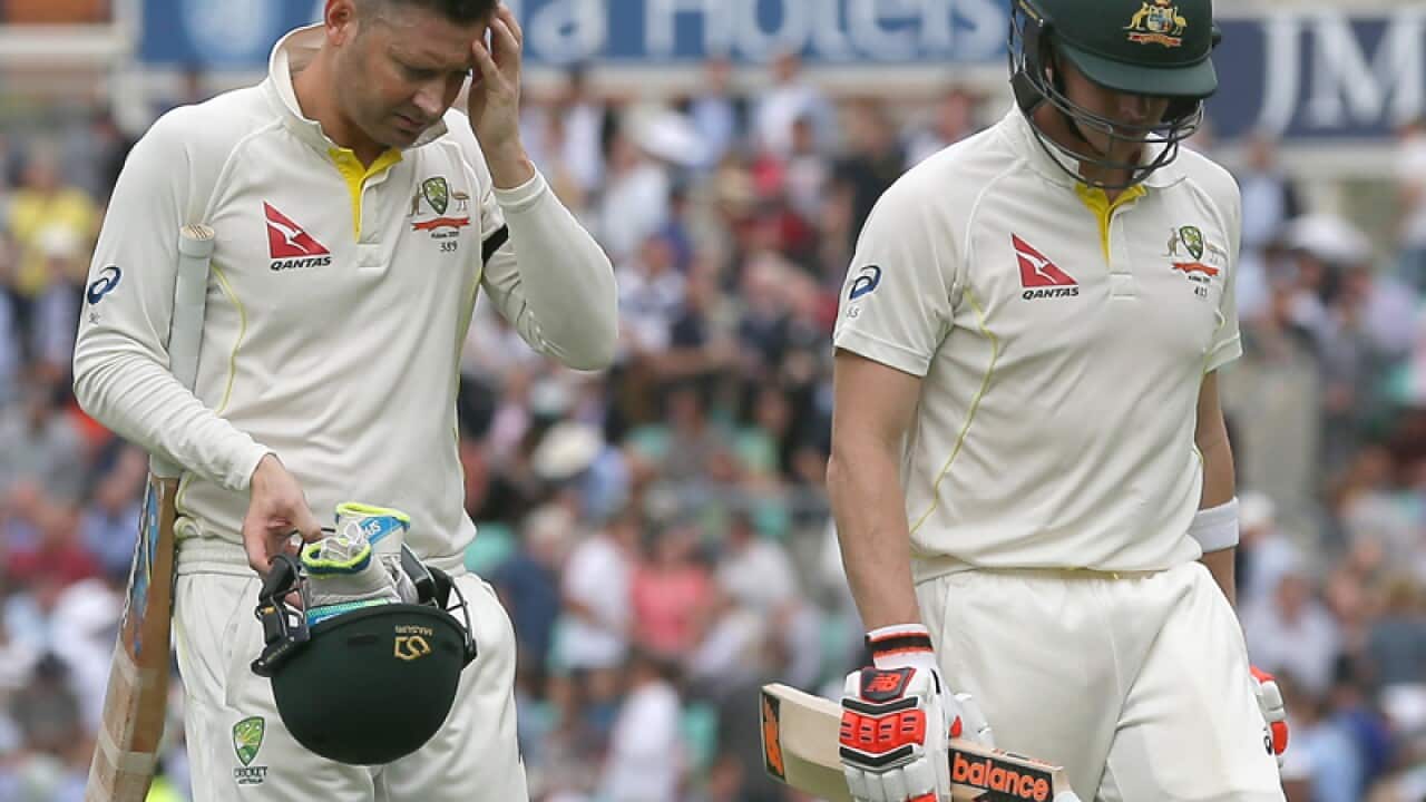 Australian batsmen Michael Clarke (L) and Steve Smith