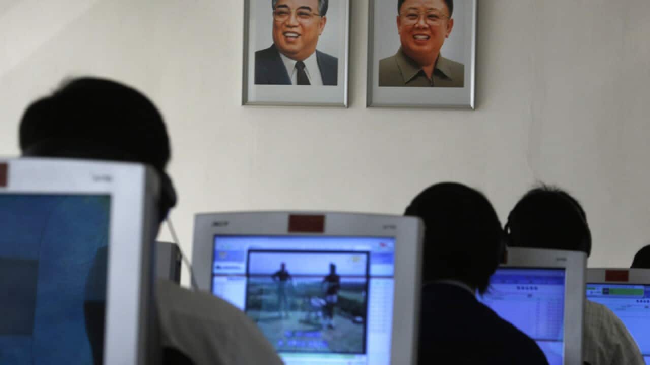 file photo, North Korean students use computers