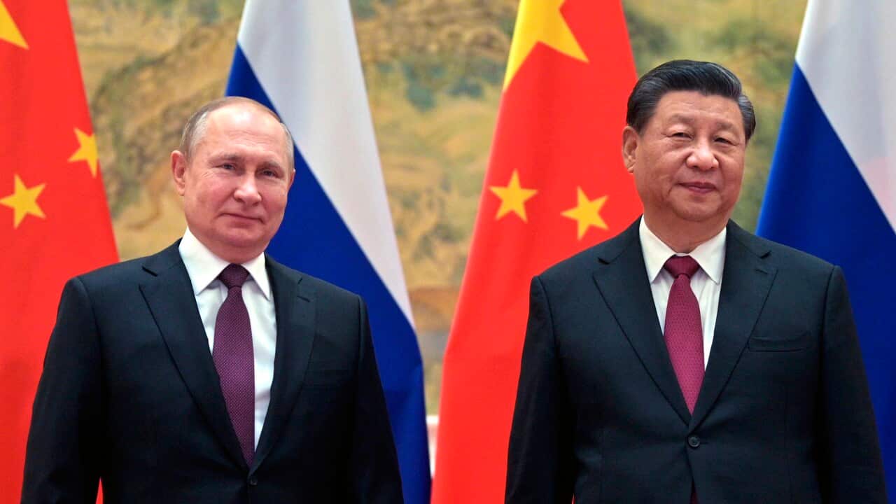 President Putin and President Xi Jinping standing next to one another