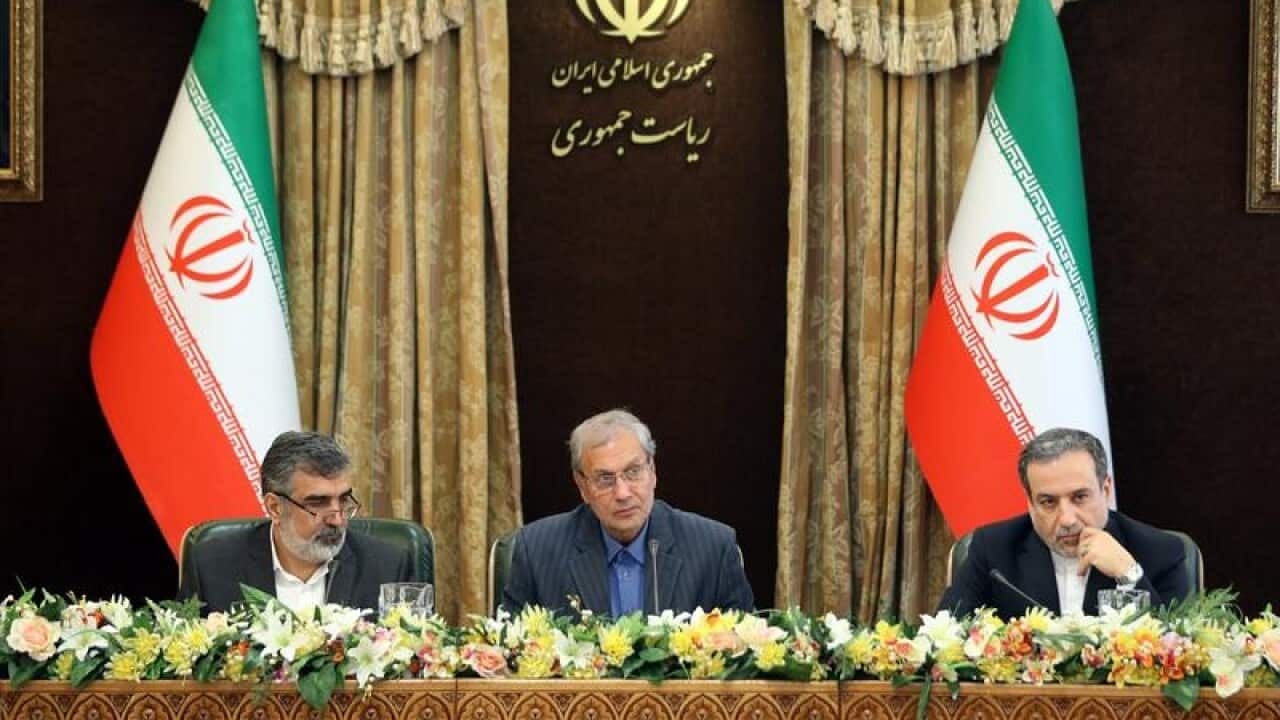 Iran's Behrouz Kamalvandi (L), Ali Rabiei (C) and Abbas Araghchi