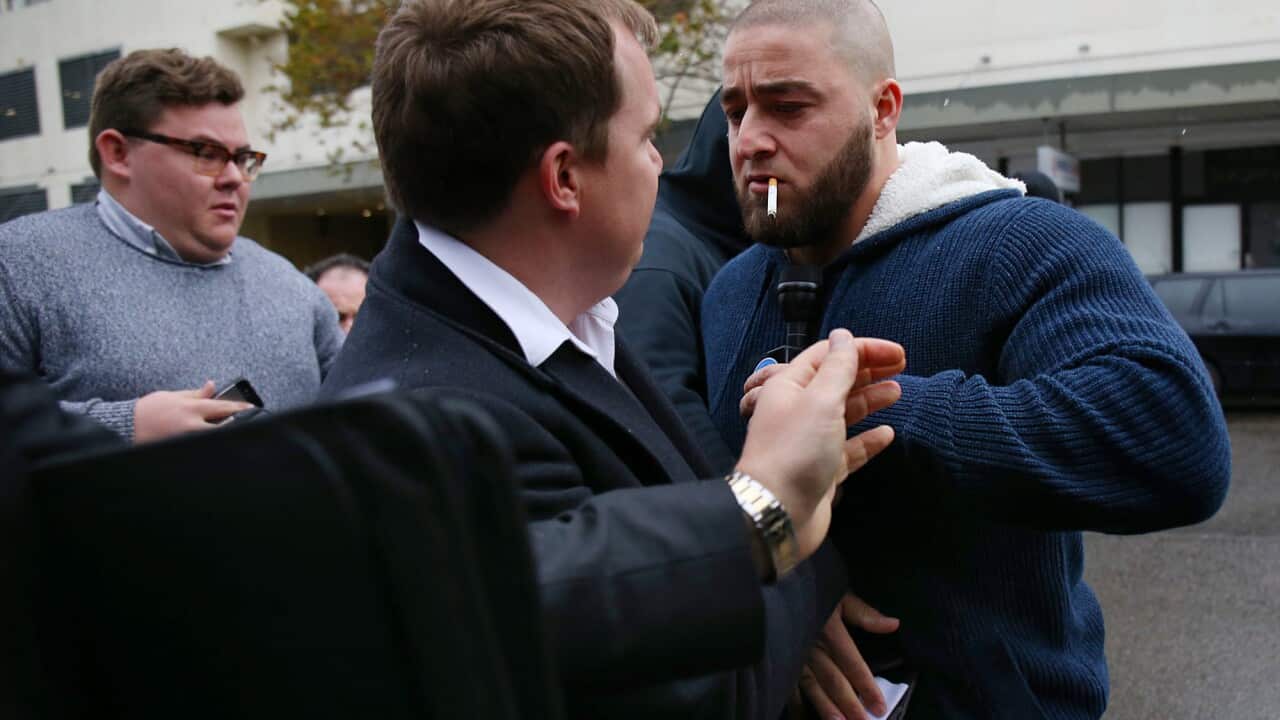 Supporters of the man accused of the murder of Sydney teenager Mahmoud Hrouk confront the media as they leave Fairfield Local Court (AAP)