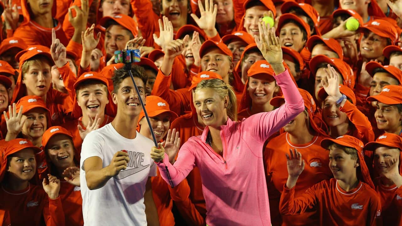 Thanasi Kokkinakis of Australia and Maria Sharapova of Russia pose for a photo with the ball kids of the Australian Open ahead of the 2015 Australian Open at Melbourne Park  (Getty)