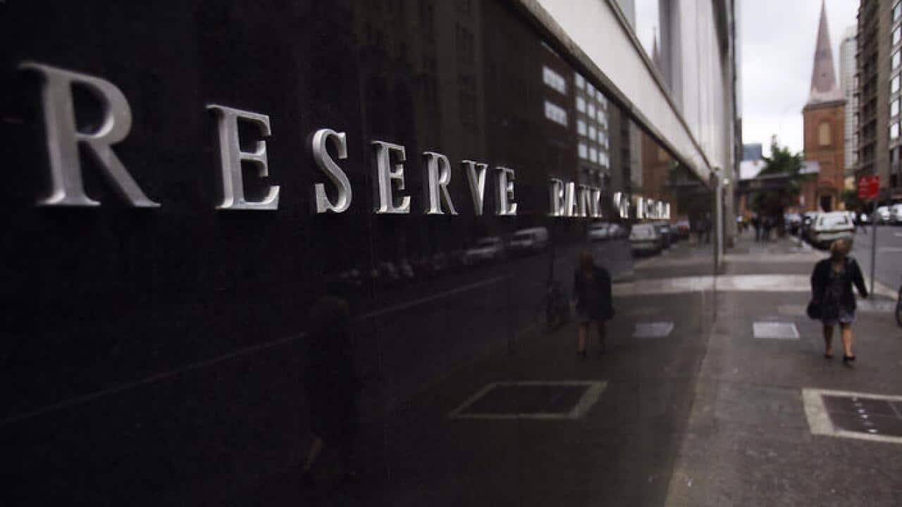 A pedestrian walks past the Reserve Bank of Australia head office in Sydney. Tuesday, Sept 2, 2014. (AAP Image/Mick Tsikas) NO ARCHIVING