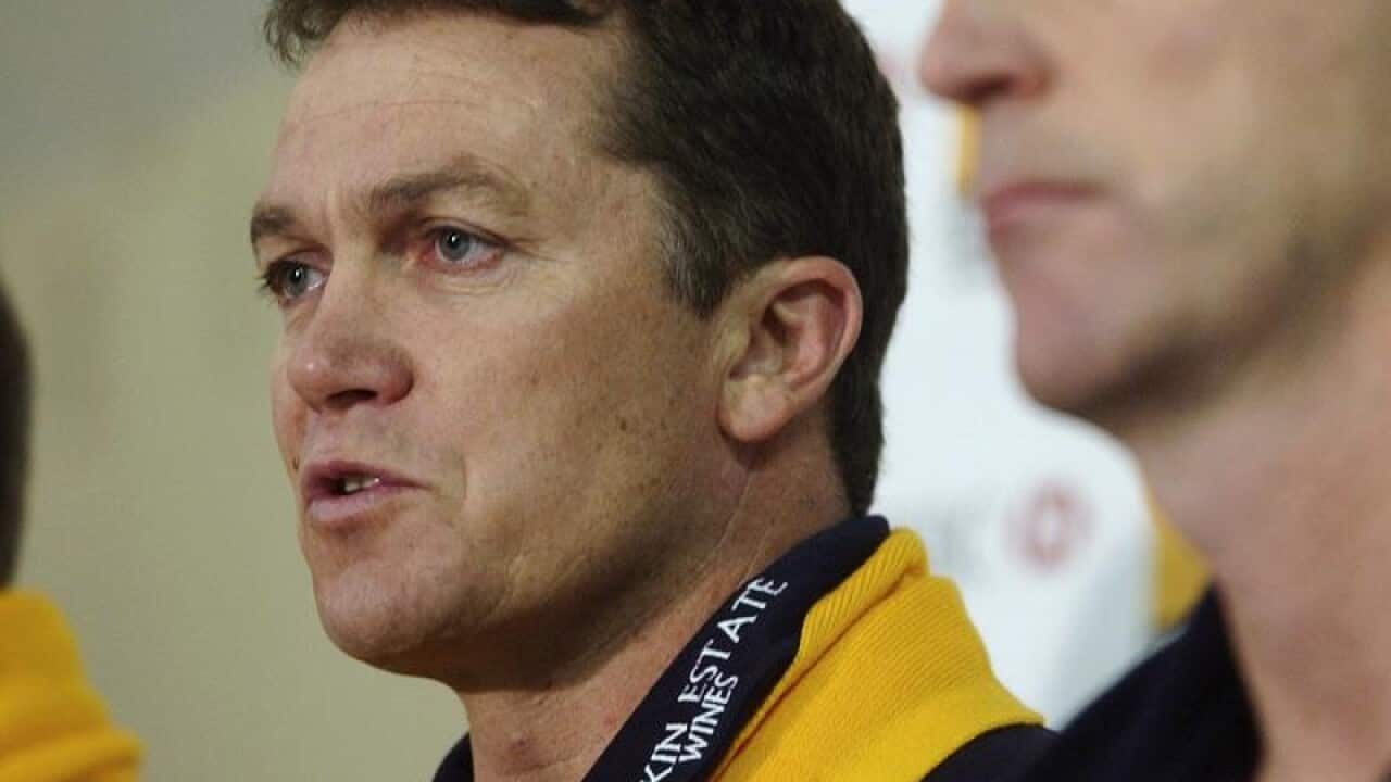 AFL football coaches Peter Schwab (left) of Hawthorn.