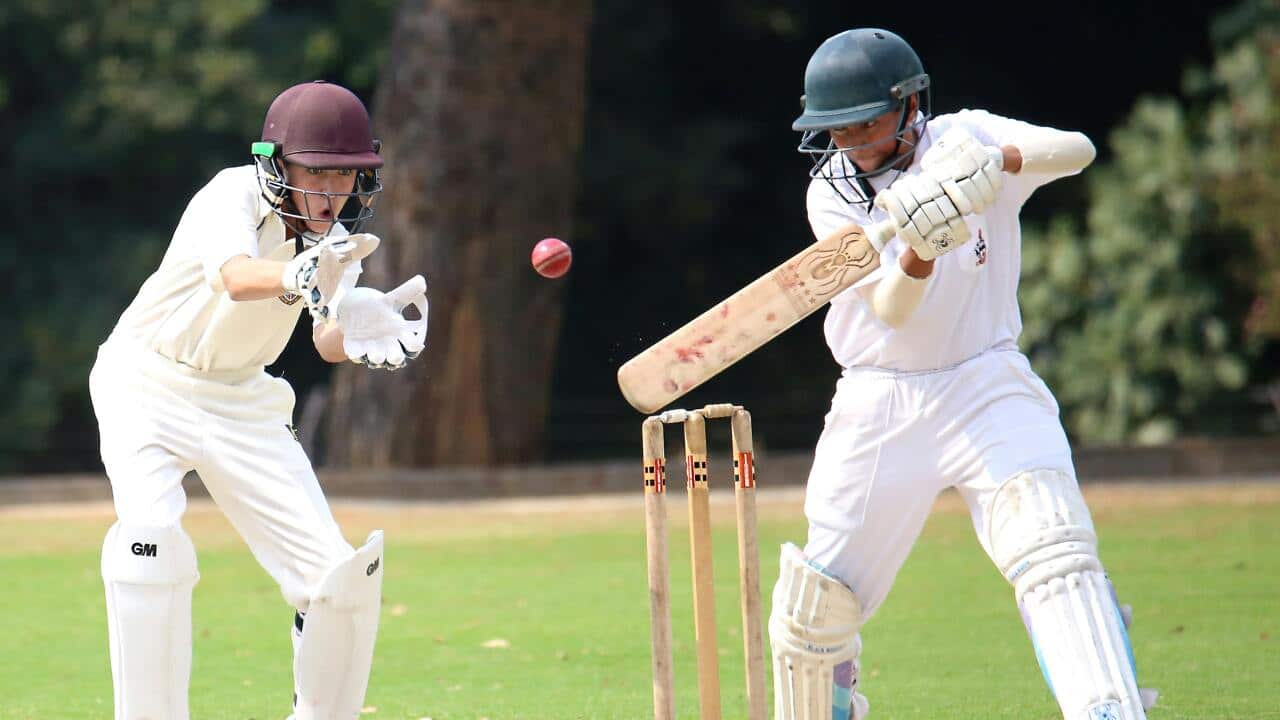 A representative image of children playing cricket.