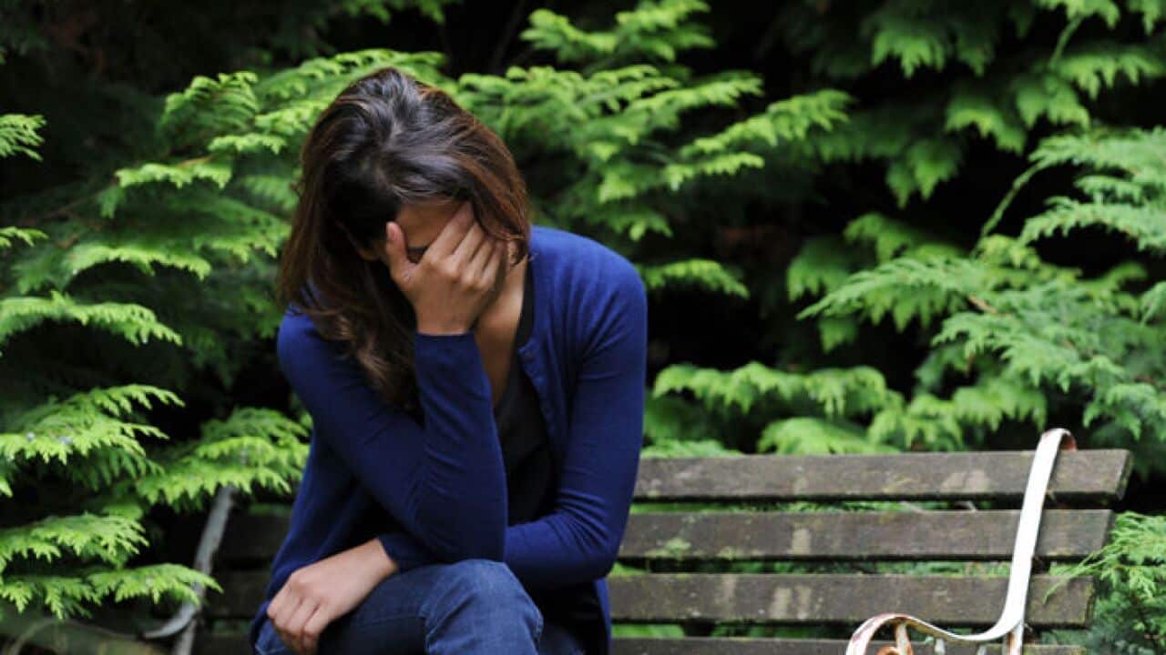 A woman showing signs of depression