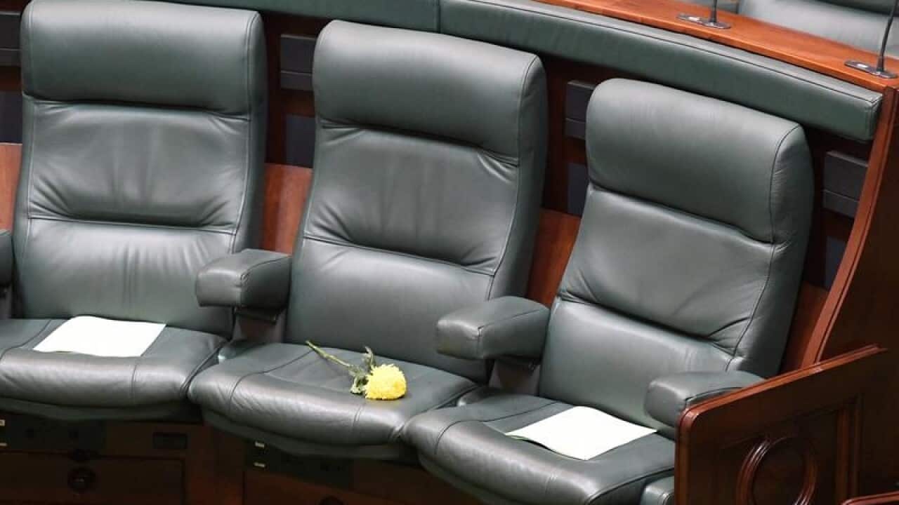 A yellow flower is placed on the seat of Victorian MP Fiona Richardson