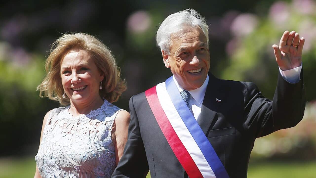 Chilean President Sebastian Pinera (right) and First Lady Cecilia Morel wave as they arrive for an official lunch at the Cerro Castillo Palace in Vina del Mar.