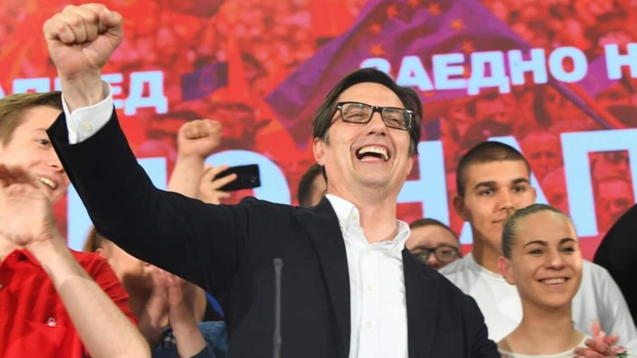 Stevo Pendarovski (C), the candidate of the ruling Social Democratic Union of Macedonia (SDSM) celebrates with supporters after declaring election victory
