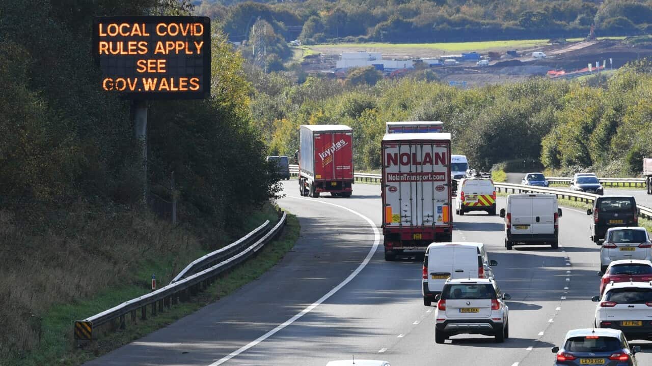 A sign on the M4 motorway near Cardiff in Wales reminds motorists of coronavirus rules.