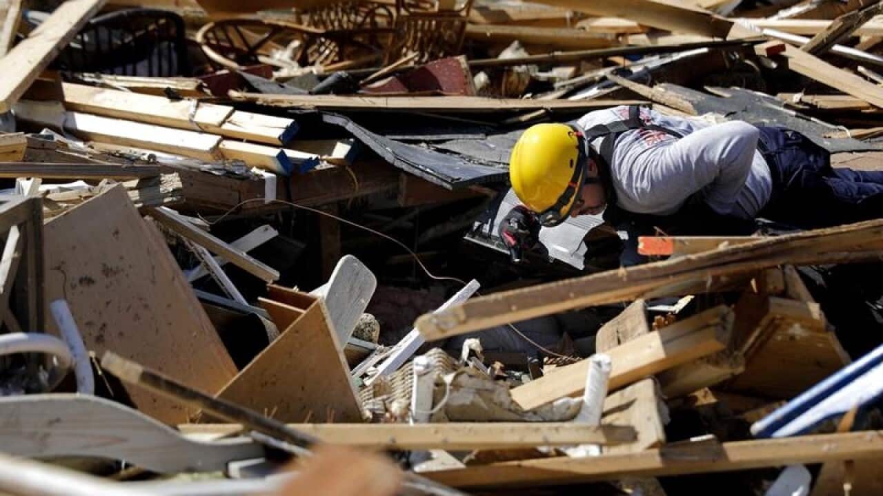 South Florida urban search and rescue team sifts through abuilding