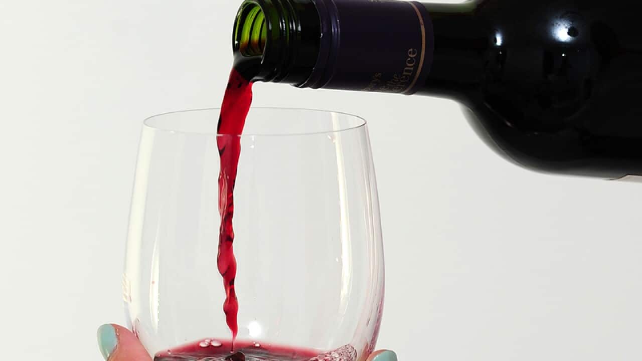 A glass of red wine.