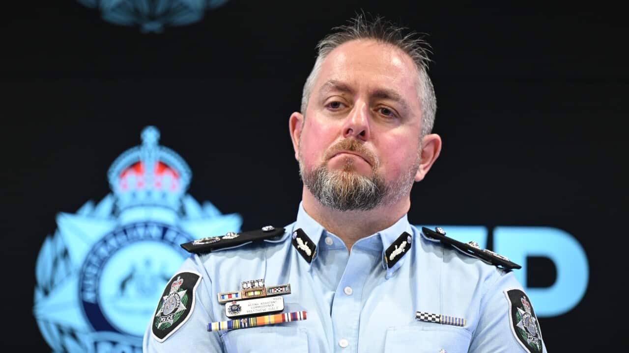 A man in a police uniform.