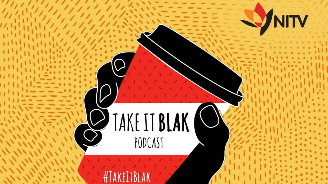 image of black power salute with fist holding coffee keep cup with Take It Blak podcast written on it.