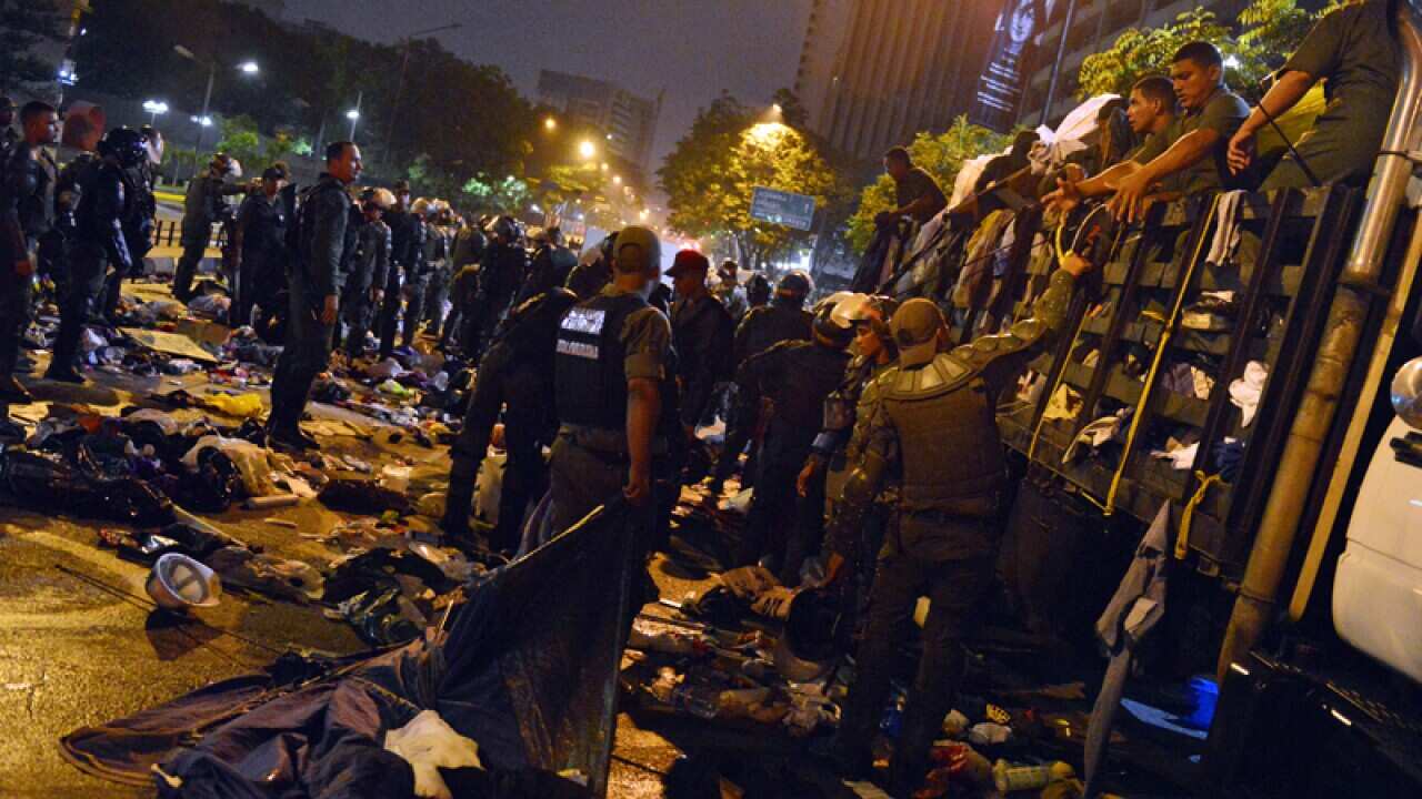 National guard personnel dismantle a student protest encampment