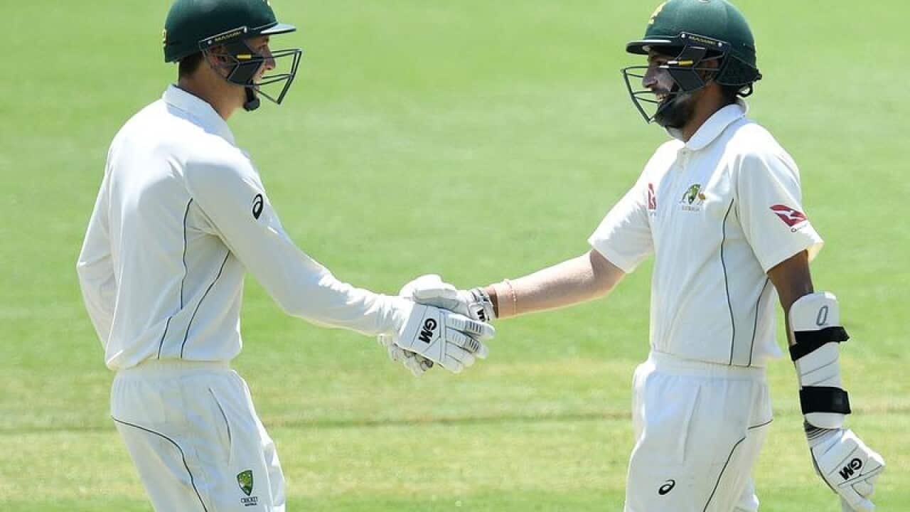 Cricket Australia XI batsman Matthew Short congratulates Jason Sangha.