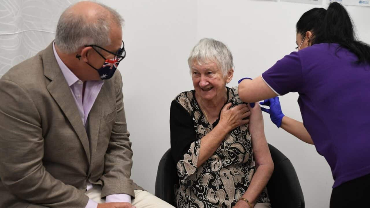 Prime Minister Scott Morrison joins Jane Malysiak (right) as she receives the first COVID-19 vaccine in Australia 