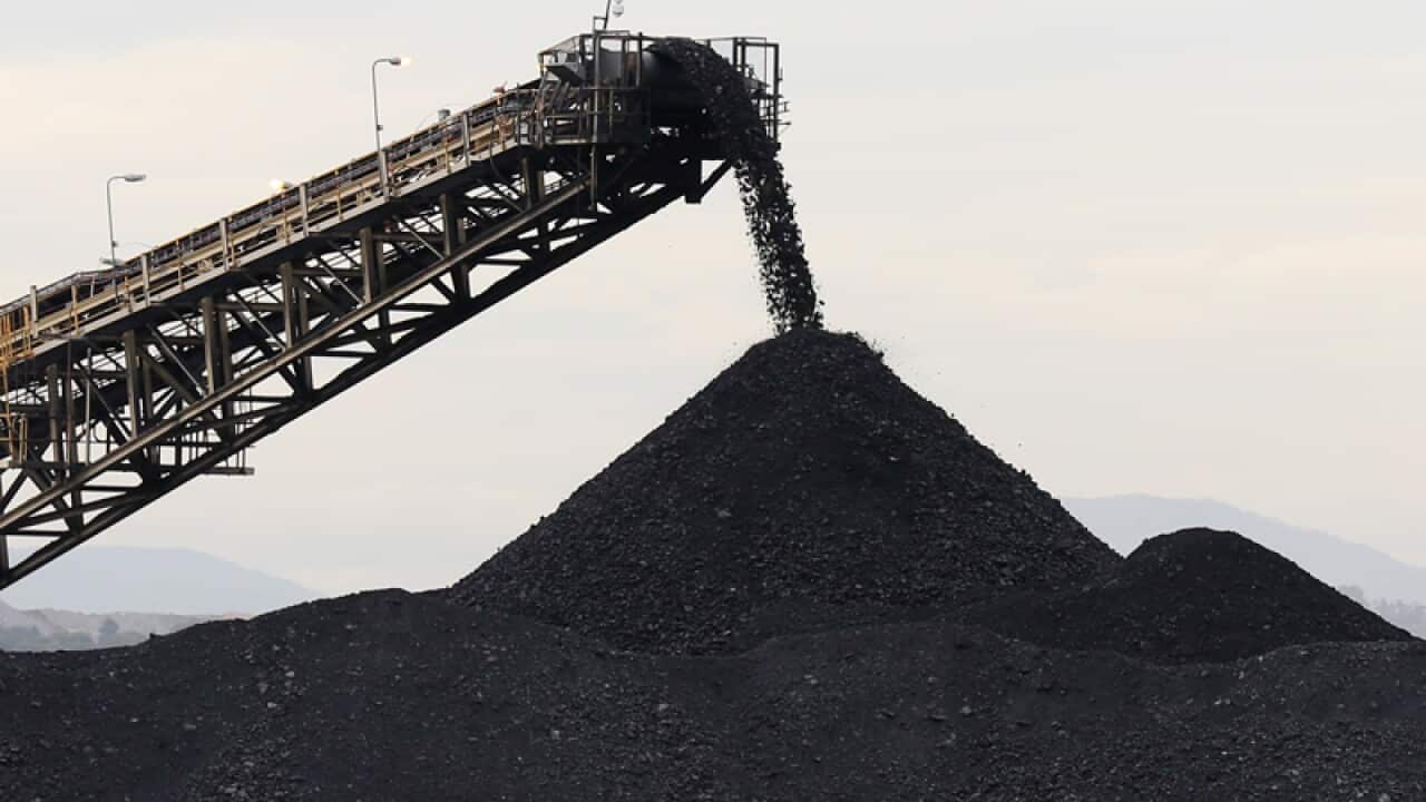 A shifter moves coal