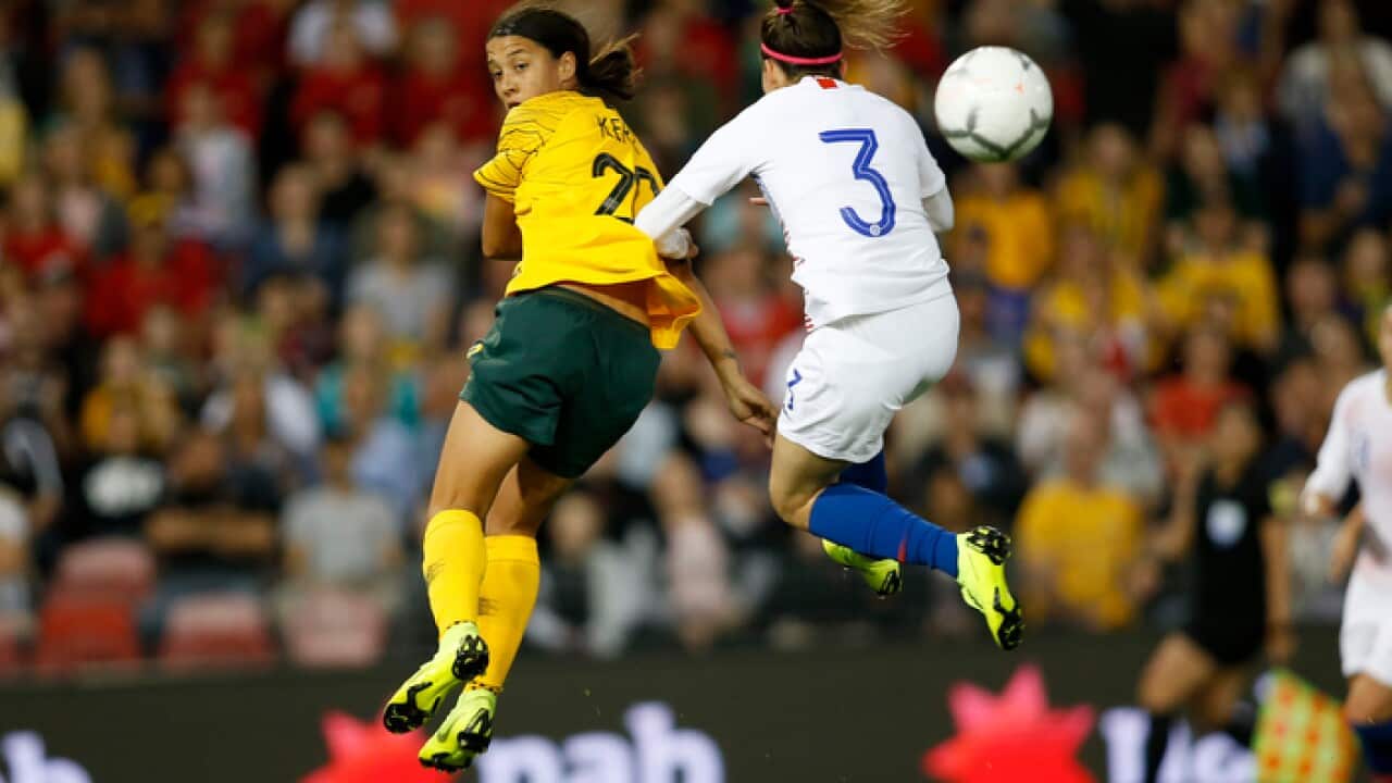 Sam Kerr of the Matildas (left) watches a goal