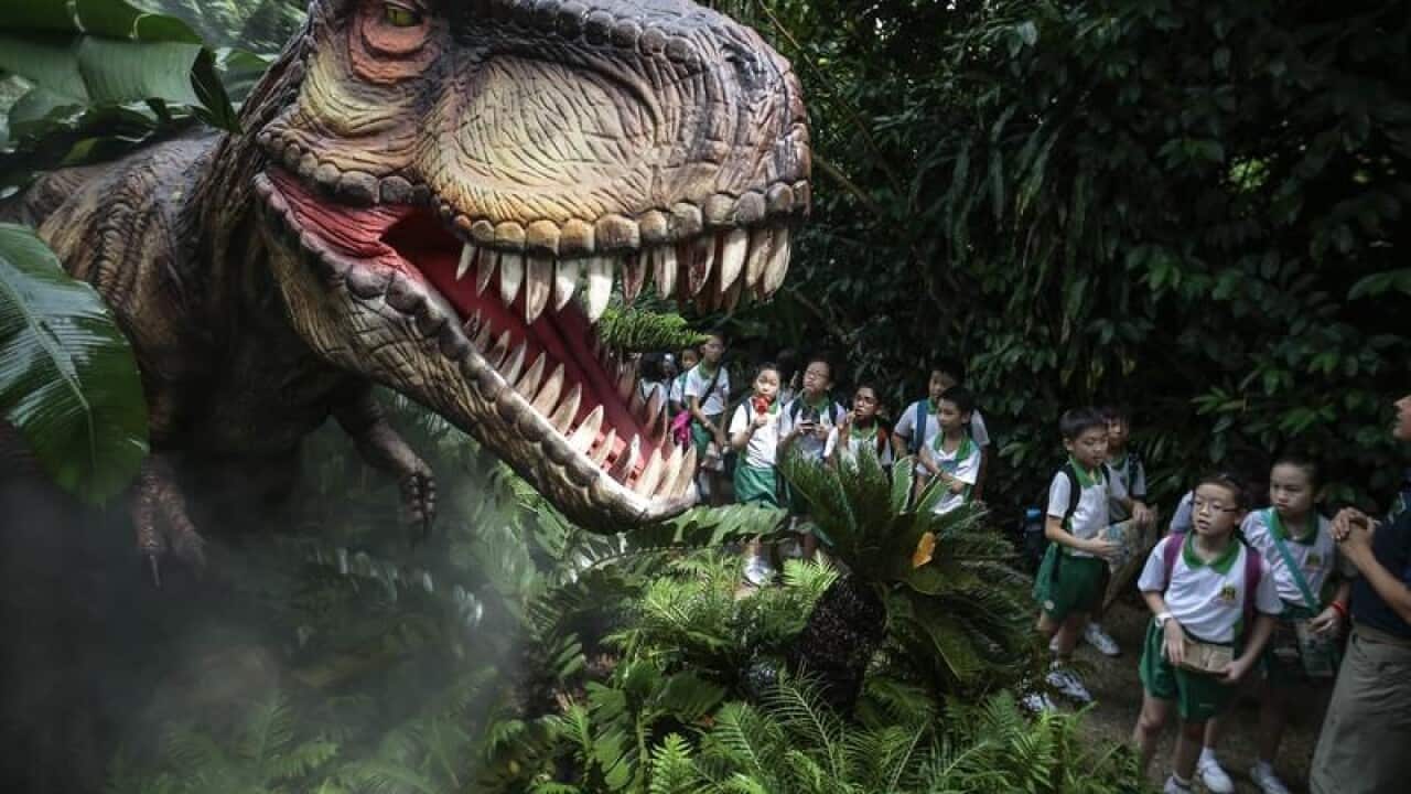 An animatronic display depicting a Tyrannosaurus Rex