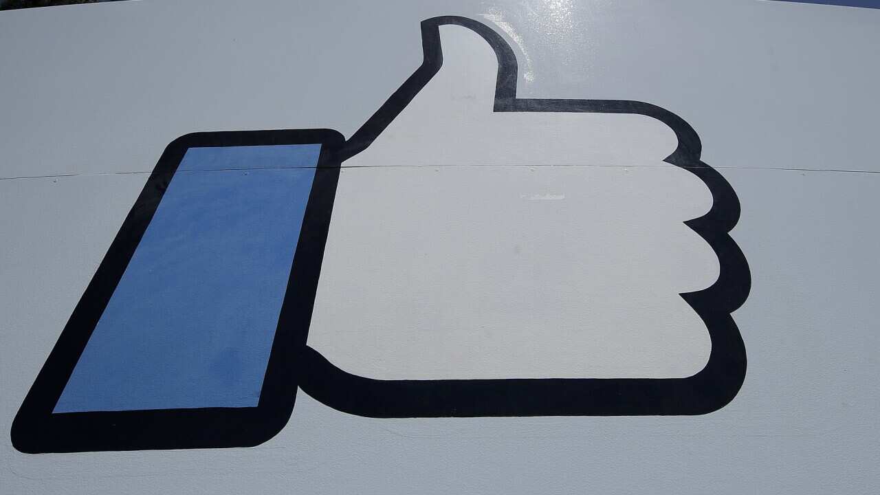 FILE, April 25, 2019, file photo shows the thumbs-up Like logo on a sign at Facebook headquarters in Menlo Park, California.