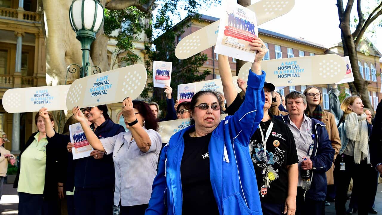 Allied health workers and union members hold a rally outside the Royal Prince Alfred Hospital, Sydney.