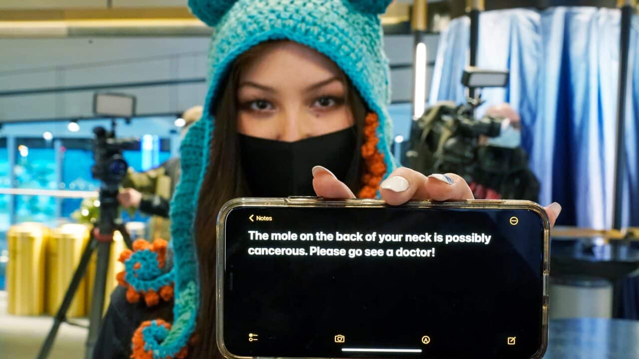 Seattle Kraken fan Nadia Popovici poses for a photo before an NHL hockey game between the Kraken and the Vancouver Canucks.