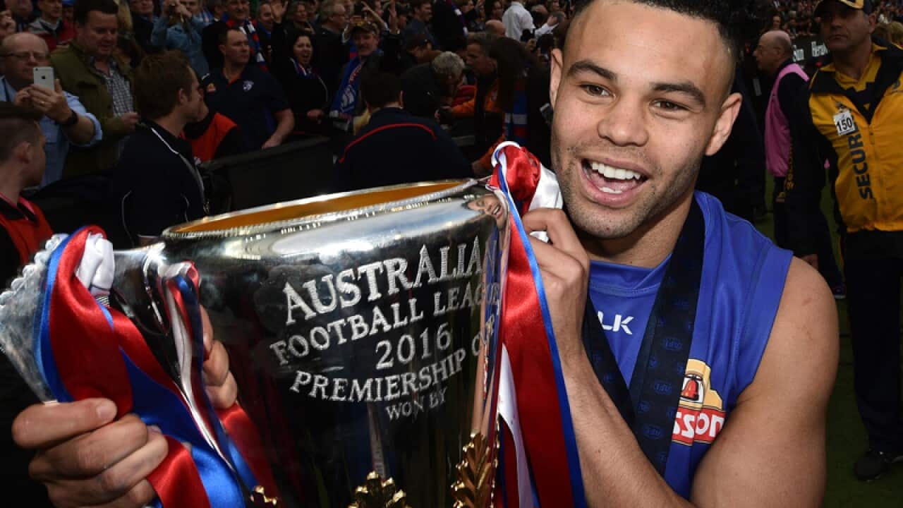 Jason Johannisen kisses the AFL Premiership Cup