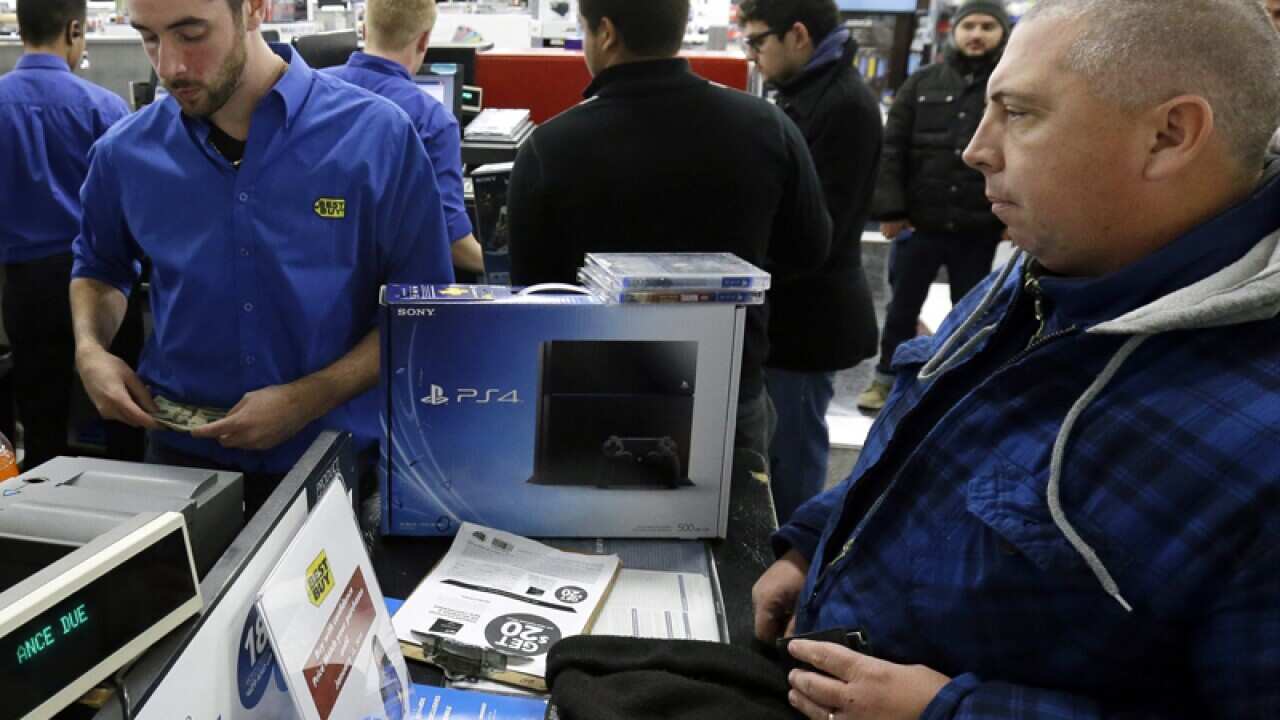A man purchases a Sony Playstation 4 from in Chicago