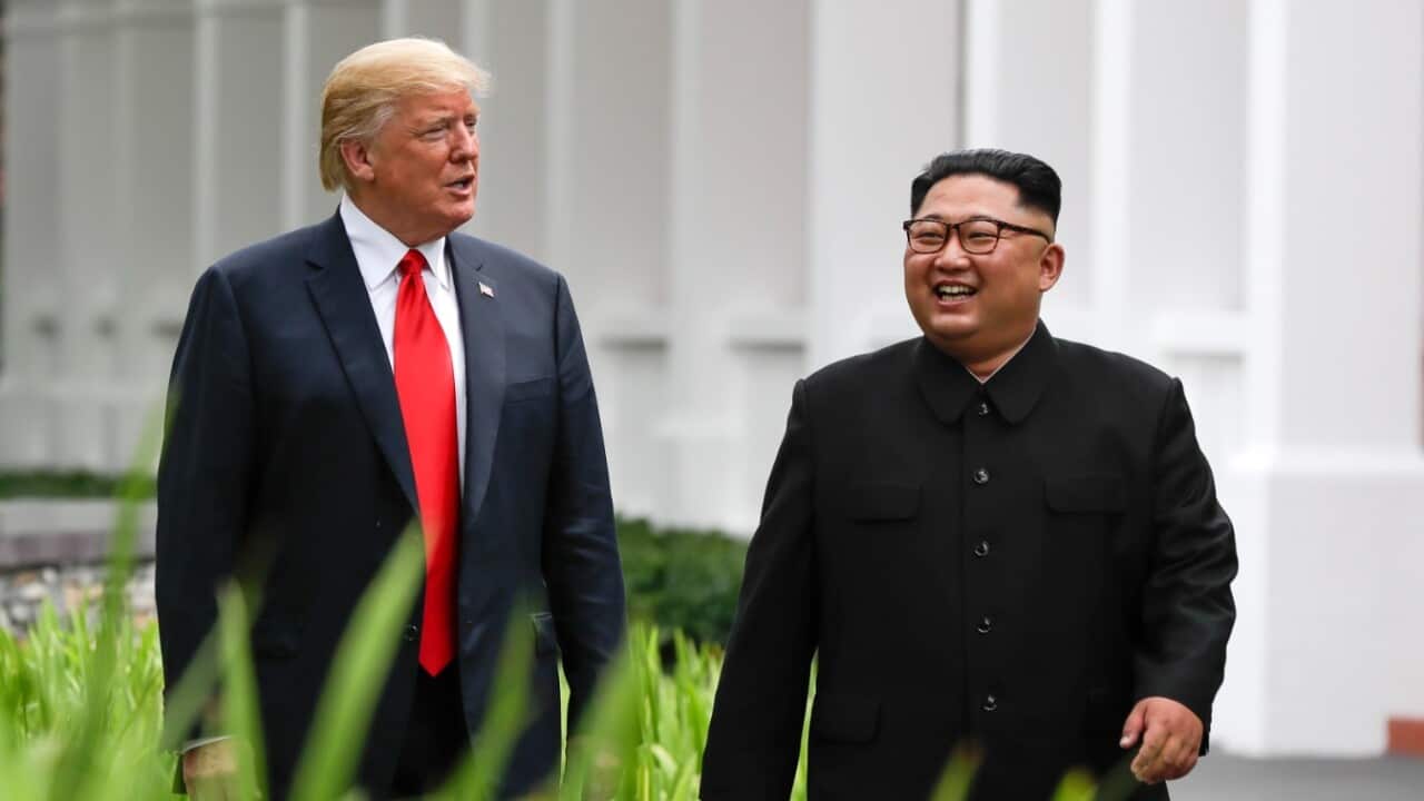 US President Donald Trump and North Korea leader Kim Jong-un walk from their lunch at the Capella resort on Sentosa Island Tuesday, June 12, 2018