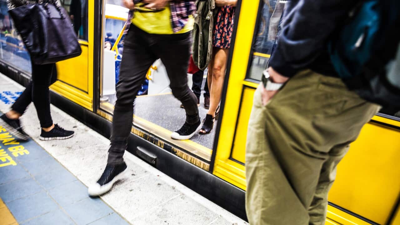 People at rush hour in Sydney trains system.