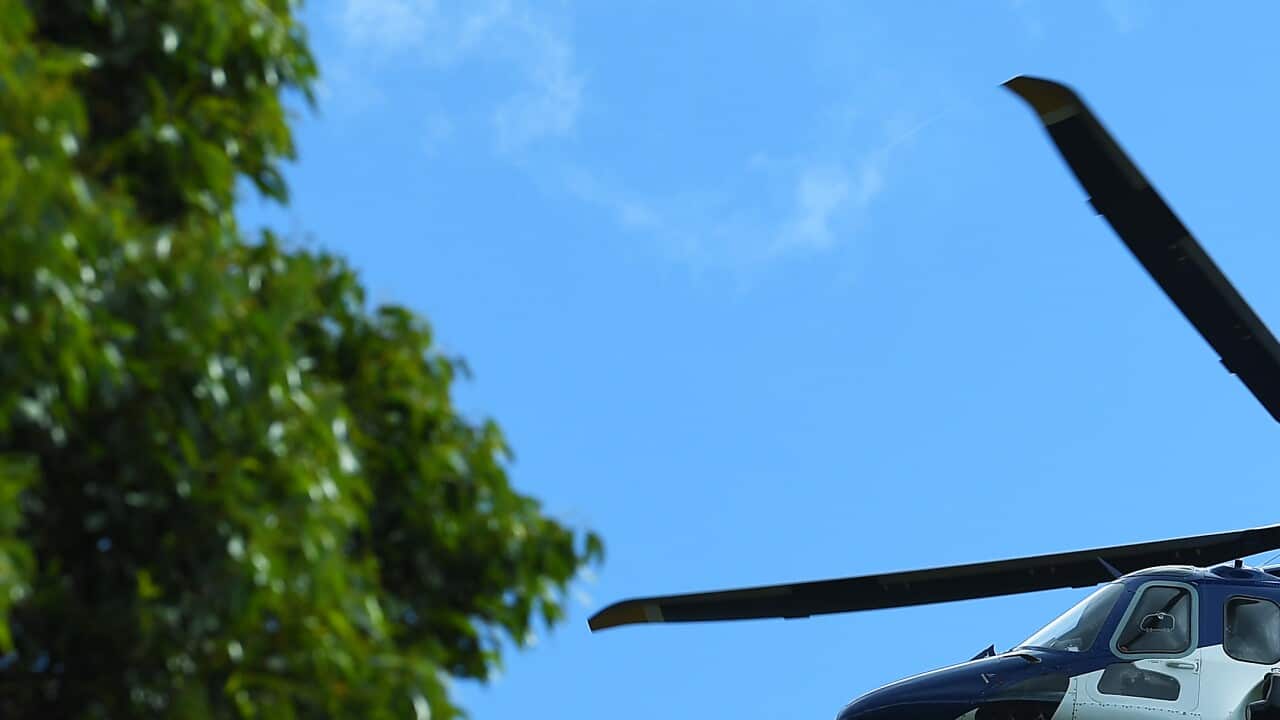 A Victorian Police helicopter is seen near a command post at Blair's Hut at Mount Disappointment in Victoria, Thursday, March 31, 2022.