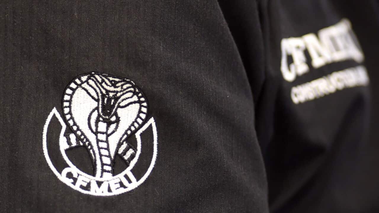A CFMEU logo is seen on a workers shirt in Canberra