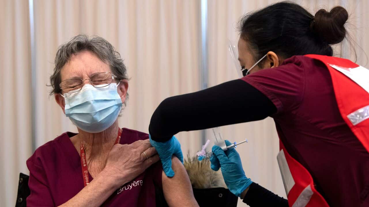 Personal support worker Johanne Lamesse receives the Pfizer-BioNTech COVID-19 vaccine at Ottawa Hospital.