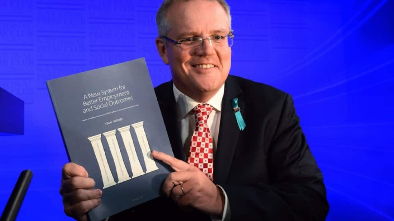 Scott Morrison holds the McClure Report