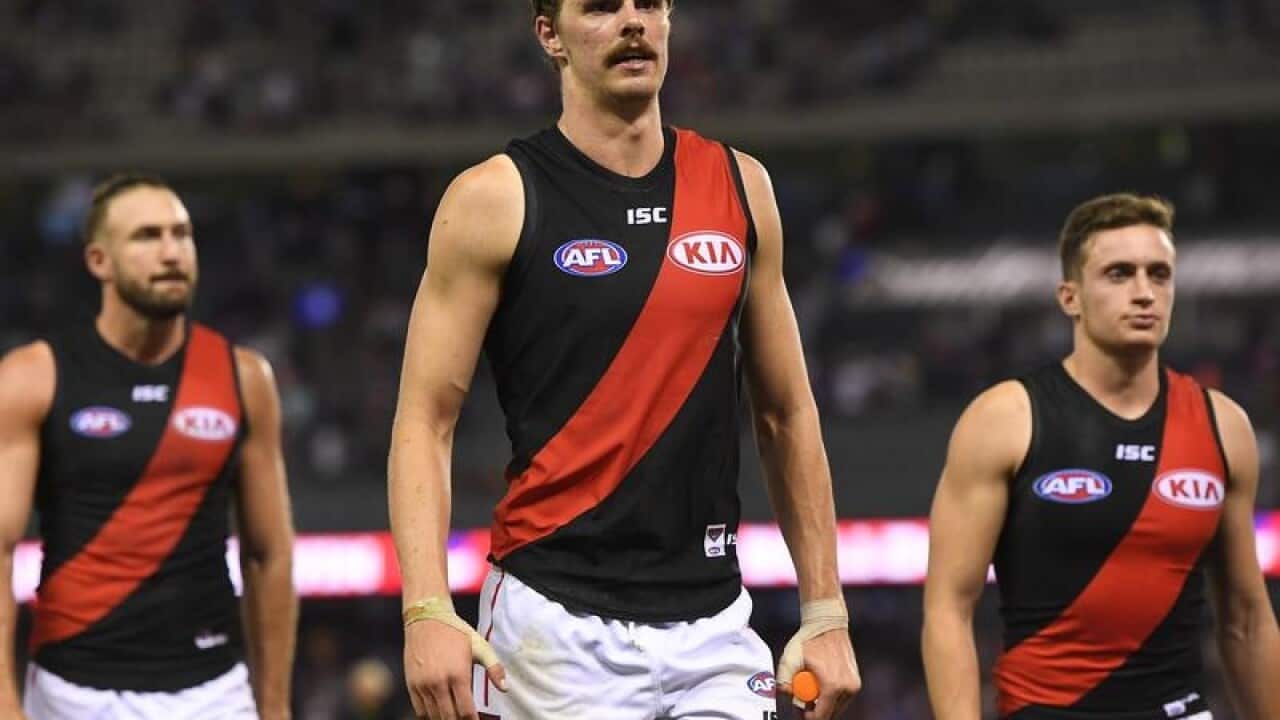 Joe Daniher of the Bombers exits the ground after an AFL match.