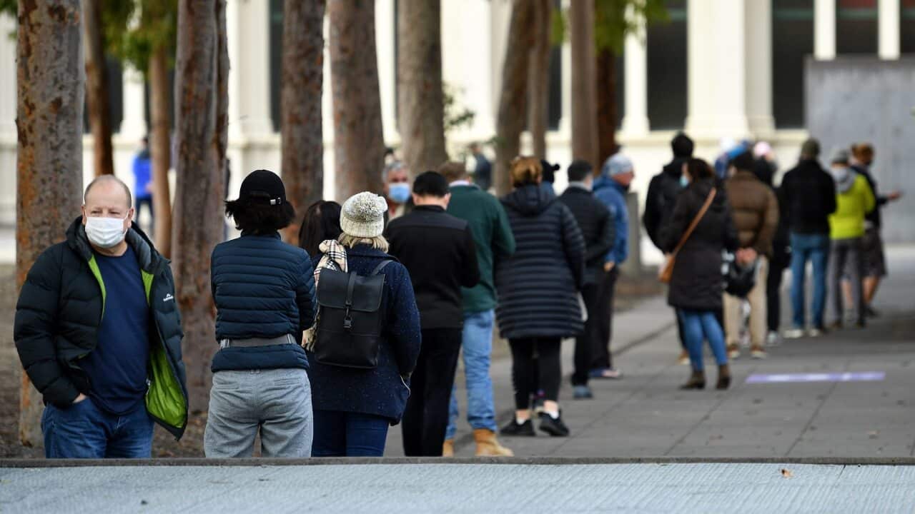 People are seen lining up outside of COVID-19 vaccination centre in Melbourne on 1 June 2021.