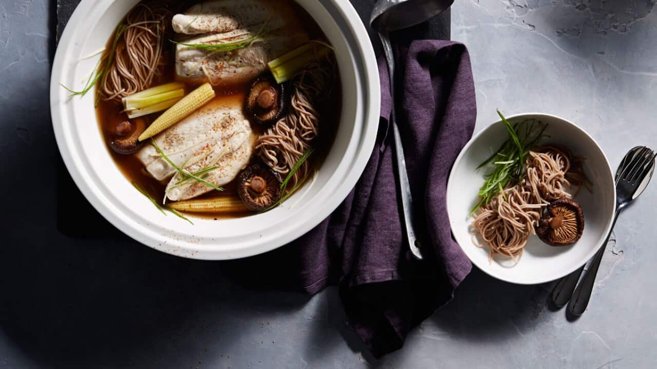 Japanese-style mushroom and leek broth with poached fish