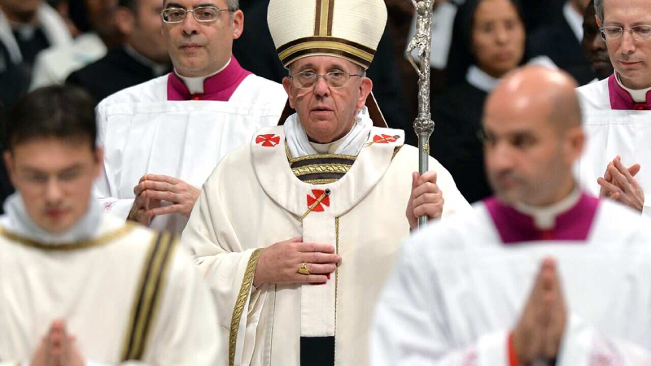 Pope Francis (C) during Christmas Mass in Saint Peter's Basilica