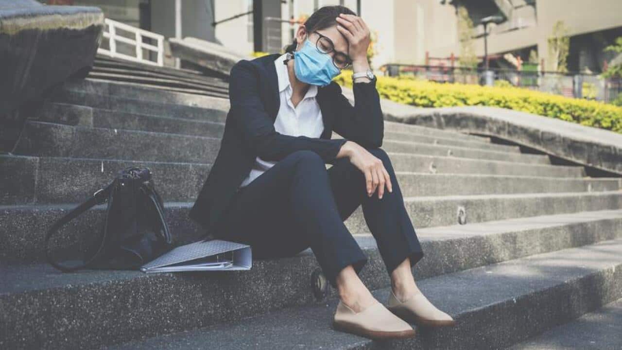Unemployed businesswoman having stressed after failure and laid off from work because impact from covid-19 pandemic outbreak and economic depression.